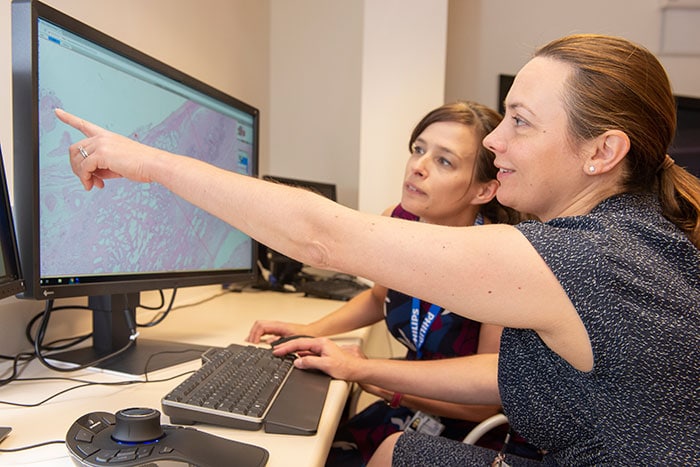 Download image (.jpg) Dr Lisa Browning and Professor Clare Verrill, Honorary Consultant in Cellular Pathology at Oxford University Hospitals working with Philips IntelliSite Pathology Solutions Image Management System